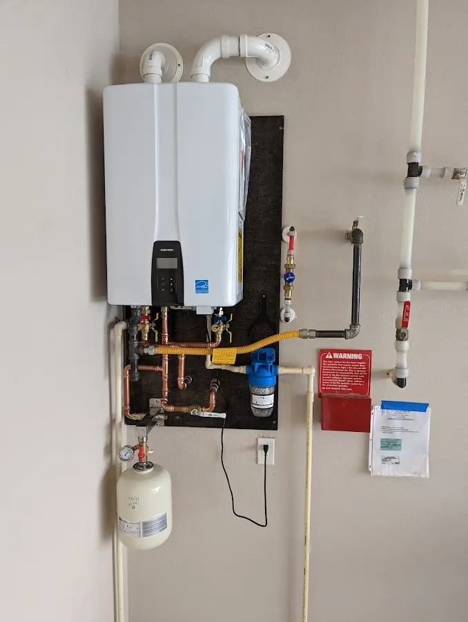 Professional plumber installing copper piping in a Wisconsin Dells home